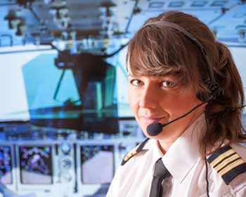 Female Commercial Airline Pilot Poses for Photo