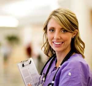 Female Nurse Smiles While on Shift Photo