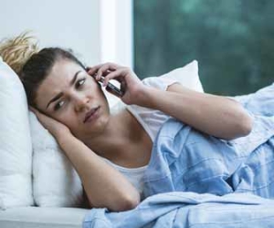Woman In Bed Calling In Sick Picture