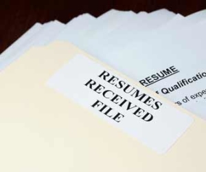 Stack of resumes in a folder picture