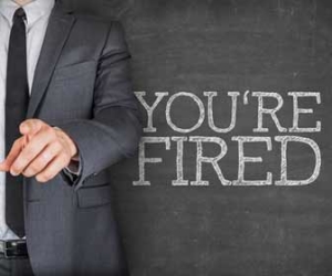 Man with sign saying you're fired picture