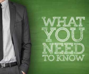 Businessman in tie with text "What You Need To Know"