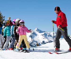 Ski Instructor Teaching Children's Ski School Class