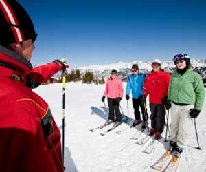 Ski Instructor Teaching Adult Ski School Class
