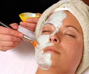 Woman getting Mud Mask Treatment at Spa