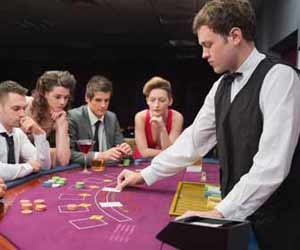 Casino Blackjack Dealer Deals Cards on Cruise Ship