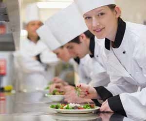Restaurant Kitchen Staff Preparing Salads for Customers