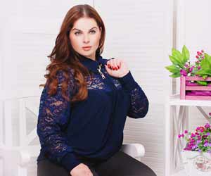 Pretty Plus Size Model Poses in Sweater during Photo Shoot