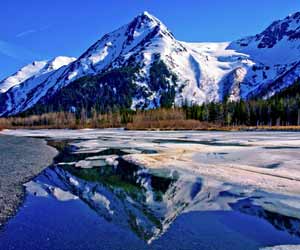 Snowy Mountain and Reflection in National Park in Alaska