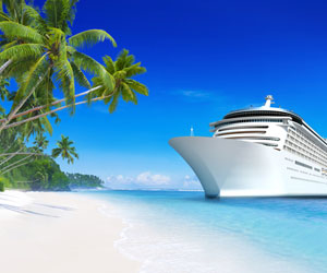 Cruise ship on tropical beach on perfect day