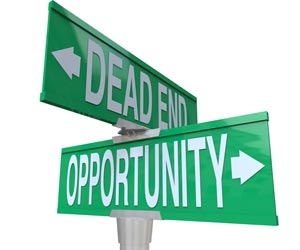 Street signs reading Dead End and Opportunity in different directions
