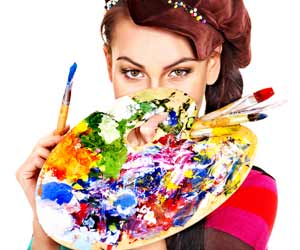 Art teacher with paint palette with paintbrushes covering her face