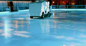 Zamboni Driver Prepares Ice for Hockey Game
