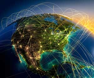Air travel routes lit up on picture of glboe
