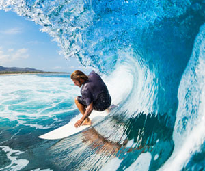Big wave surfer in the barrel of a wave