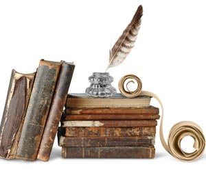 Historical books and quill for writing on white background