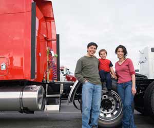 Truck Driver Poses with his Family