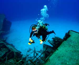 Salvage Diver Reviewing Sunken Ship