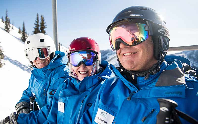Snowsports Instructors Ride Chairlift at Crystal Mountains Ski Resort